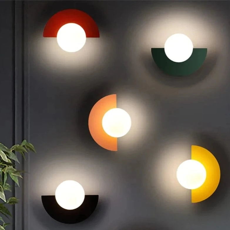 Verthara Frosted Globe Wrought Iron Wall Light