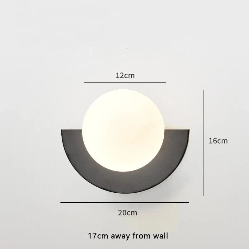 Verthara Frosted Globe Wrought Iron Wall Light